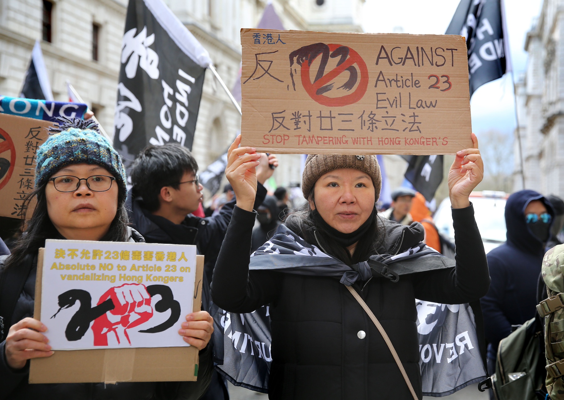 protesters signs against article 23 hong kong